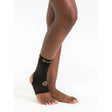 Black ankle support brace on a person's ankle with a white background - okotoks hc pharmacy