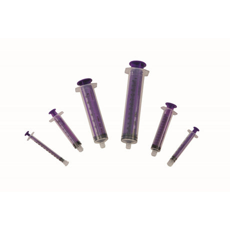 Set of purple syringes on a white background - okotoks hc pharmacy