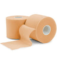 Two rolls of beige elastic tape on a white background - okotoks hc pharmacy
