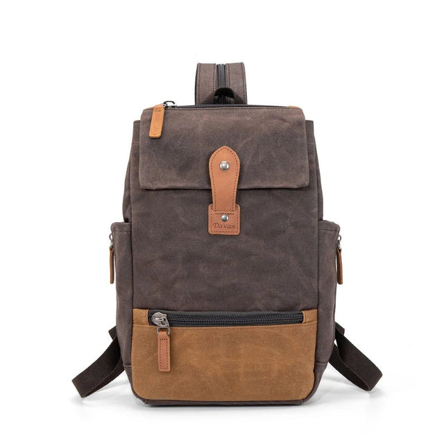 Brown and beige backpack with leather accents on a white background - okotoks hc pharmacy