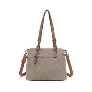 Beige handbag with brown straps on a white background - okotoks hc pharmacy