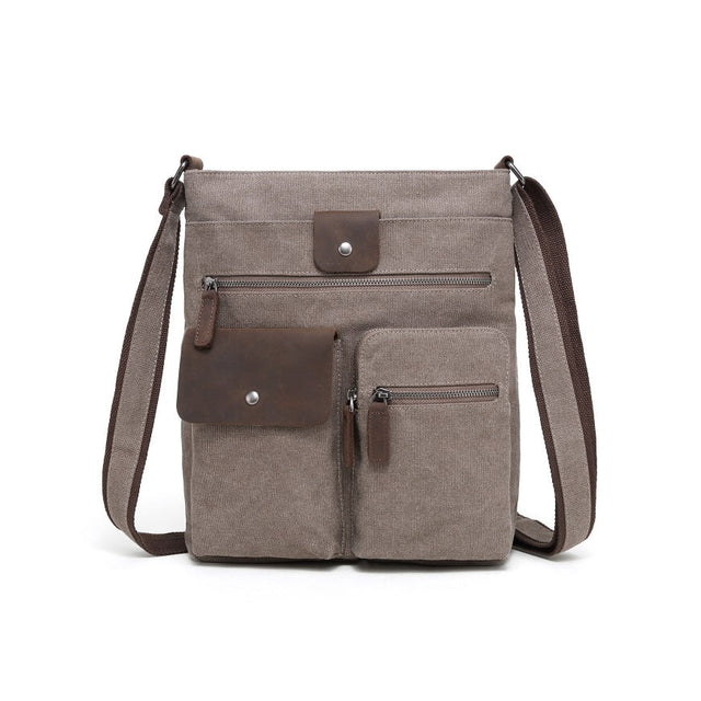 Brown crossbody bag with leather accents on a white background - okotoks hc pharmacy