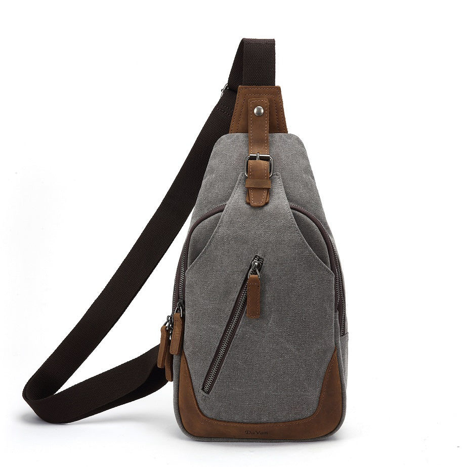 charcoal sling bag with brown accents on a white background - okotoks hc pharmacy