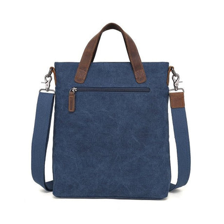 Blue tote bag with brown straps on a white background - okotoks hc pharmacy