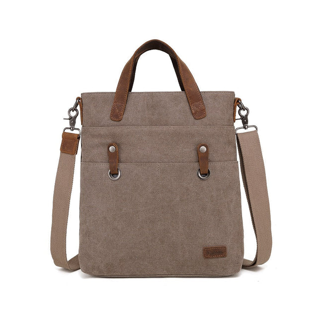 Brown canvas handbag with leather straps on a white background - okotoks hc pharmacy
