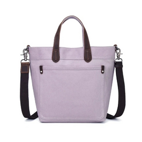 Purple tote bag with brown handles and black straps on a white background - okotoks hc pharmacy