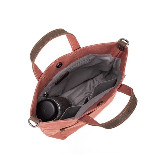 Open pink bag with a gray interior showing a black mug. - okotoks hc pharmacy