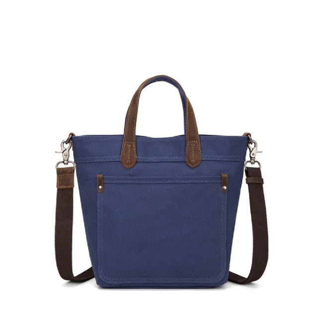Blue tote bag with brown handles and strap on a white background - okotoks hc pharmacy
