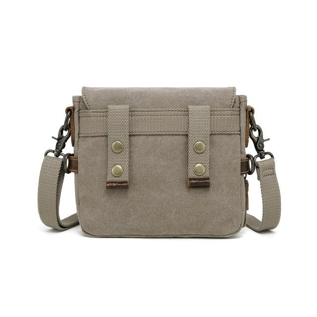 Beige crossbody bag with metal accents on a white background - okotoks hc pharmacy