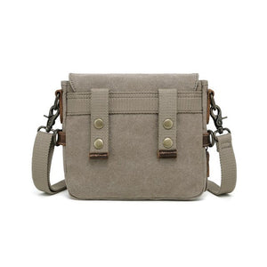 Beige crossbody bag with metal accents on a white background - okotoks hc pharmacy