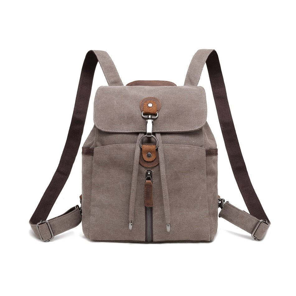 Brown backpack with leather accents on a white background - okotoks hc pharmacy