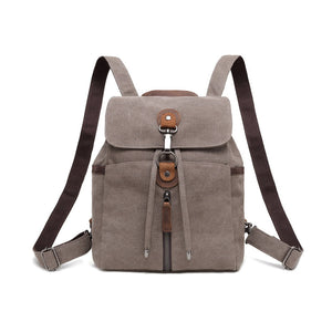 Brown backpack with leather accents on a white background - okotoks hc pharmacy