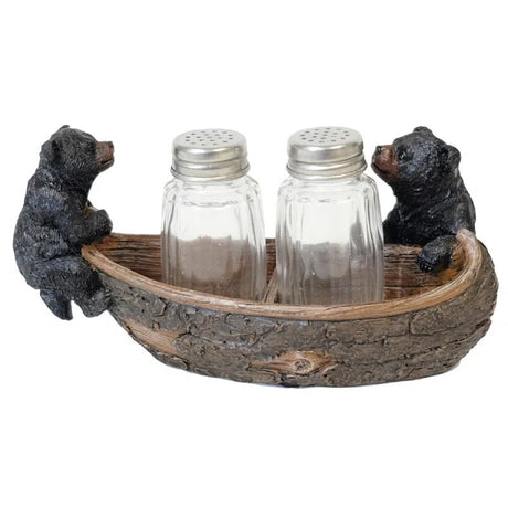Decorative salt and pepper shaker set with bear figures on a wooden tray. - okotoks hc pharmacy
