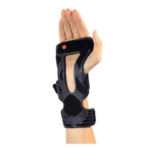 Black wrist brace on a person's hand against a white background - okotoks hc pharmacy