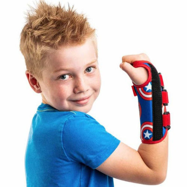 Child wearing a superhero wrist support on a white background - Okotoks HC Pharmacy
