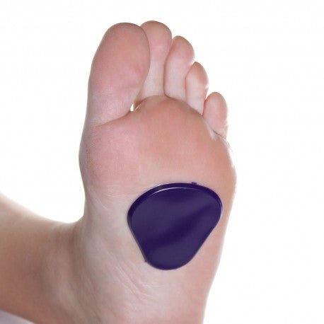 Purple bunion corrector on a foot against a white background - okotoks hc pharmacy