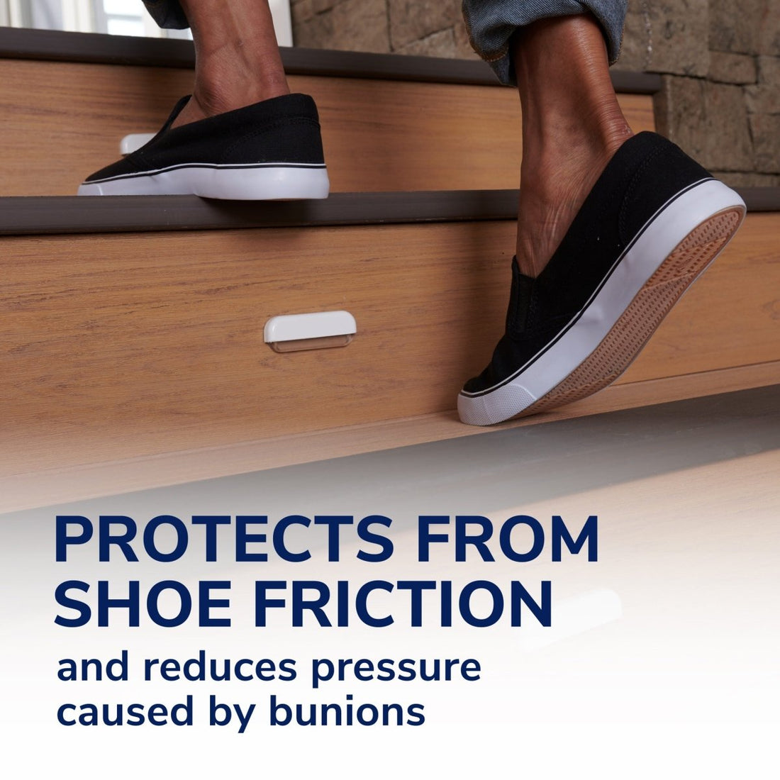 Person wearing black and white shoes stepping onto a wooden surface with text about shoe friction protection. - okotoks hc pharmacy