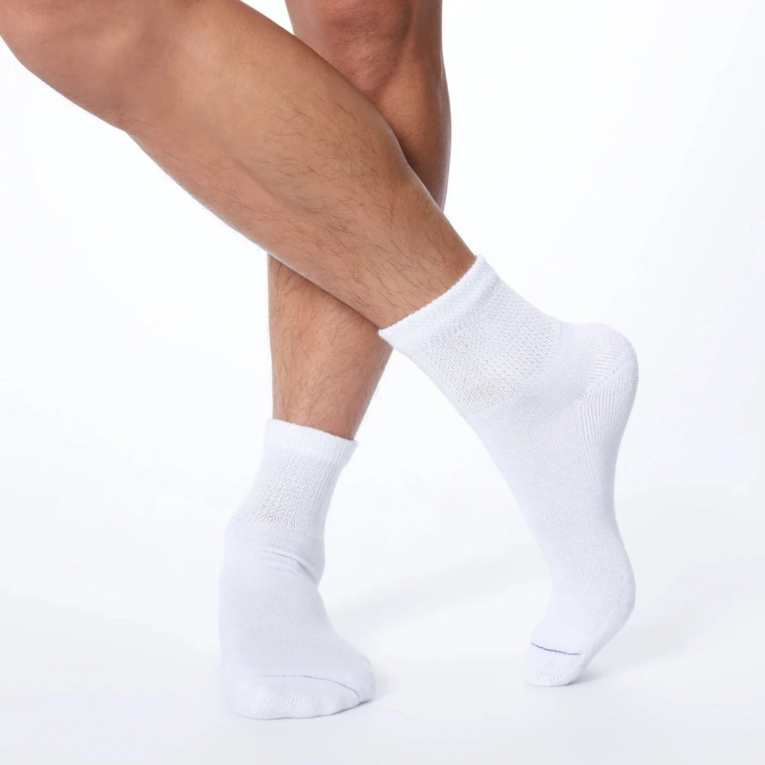 White socks worn by a person on a white background - okotoks hc pharmacy