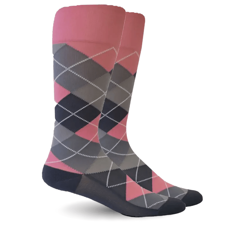 A pair of argyle socks with a color gradient transitioning from pink at the top to dark gray and navy at the bottom, featuring a white dotted diamond pattern. - okotoks hc pharmacy