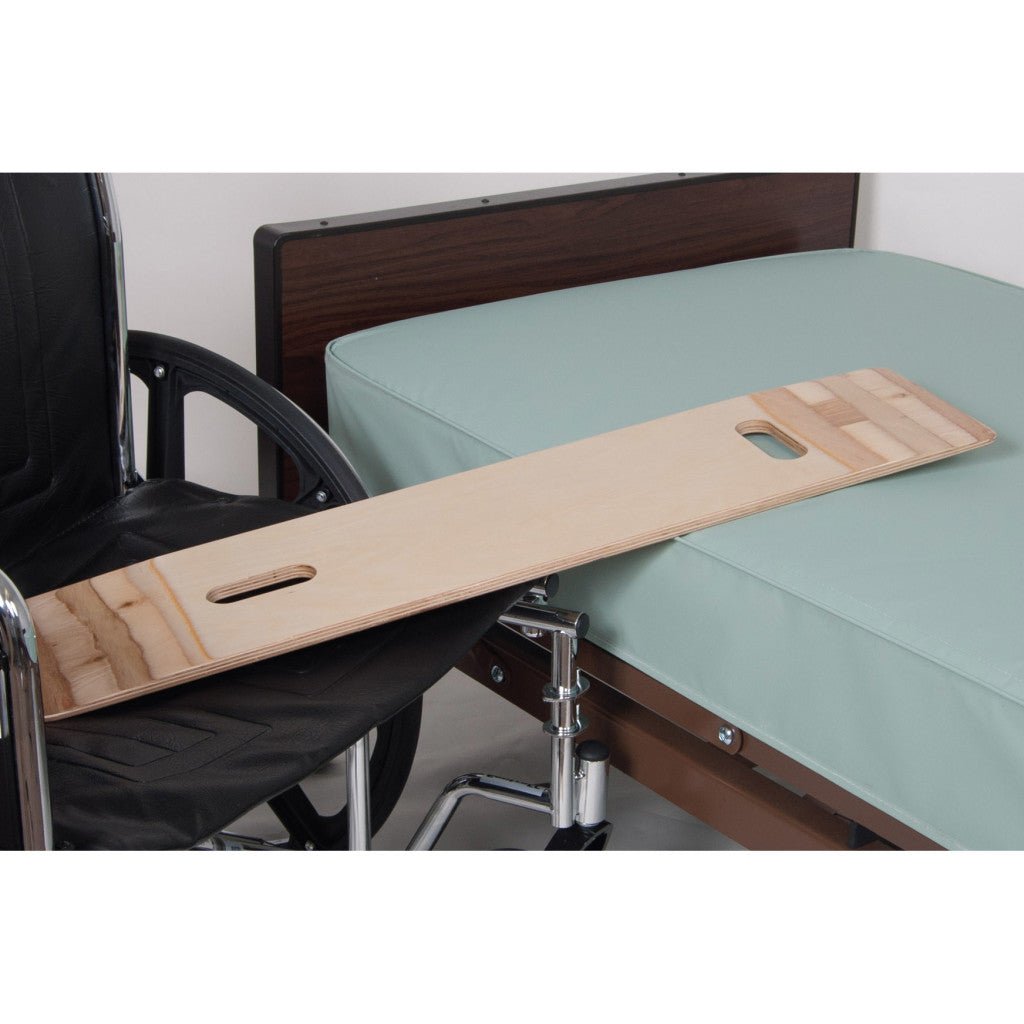 Wooden transfer board attached to a wheelchair next to a bed - okotoks hc pharmacy