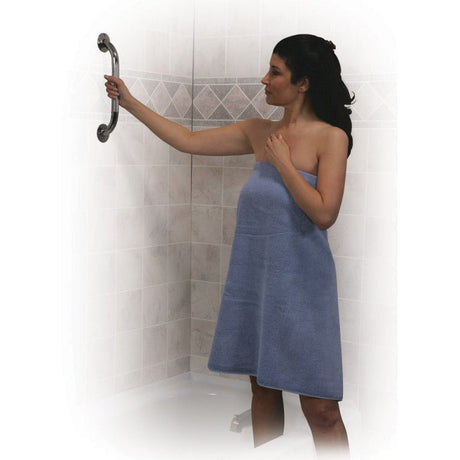Woman in a blue towel standing in a shower with a blurred background - okotoks hc pharmacy