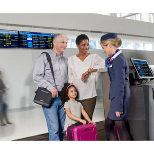 family at the airport and a family member carrying derive portable oxygen concentrator in a black bag 