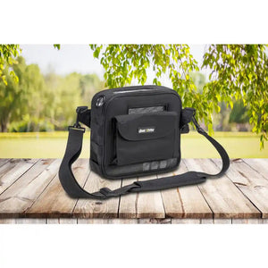 derive portable oxygen concentrator in a black carrying case on a green outdoor background