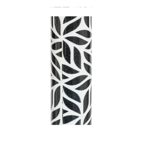 A cylindrical decorative object featuring a black and white leaf pattern, shown against a plain white background. - okotoks hc pharmacy