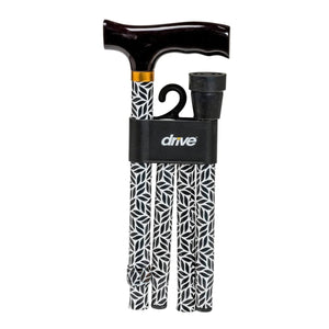 A three-piece folding cane set from the brand Drive, featuring a black T-handle with a dark wood-look grip, a black telescoping shaft with a black-and-white geometric pattern, and a black ankle support, all packaged in a black plastic sleeve with the 'drive' logo. - okotoks hc pharmacy