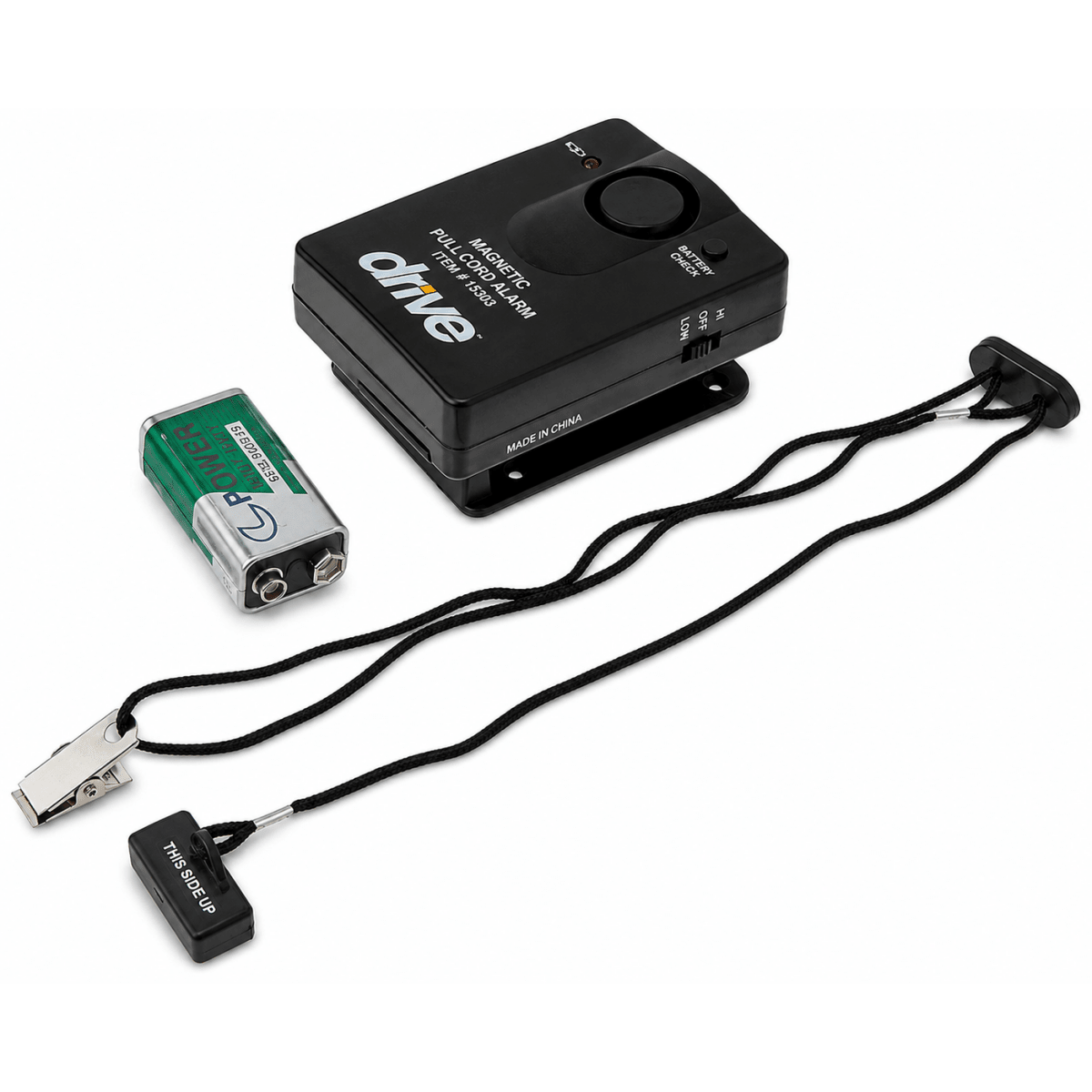 Drive Medical Magnetic Pull Cord Alarm, featuring a black control box, a green and silver 9V battery, a black clip, and a black wrist strap with a transmitter end, all on a white background. - okotoks hc pharmacy