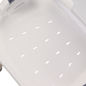 Close-up of a white plastic tray with ventilation holes on a light gray background - okotoks hc pharmacy