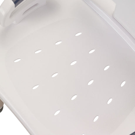 Close-up of a white plastic tray with ventilation holes on a light gray background - okotoks hc pharmacy
