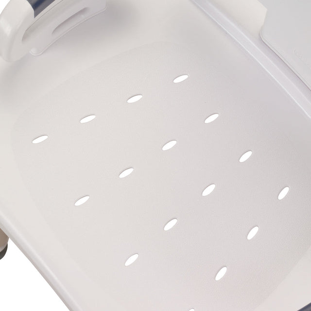 Close-up of a white plastic tray with ventilation holes on a light gray background - okotoks hc pharmacy