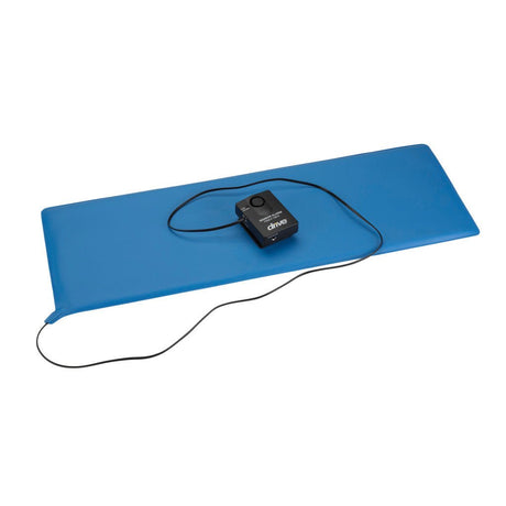 Black electronic device on a blue mat with a white background - okotoks hc pharmacy