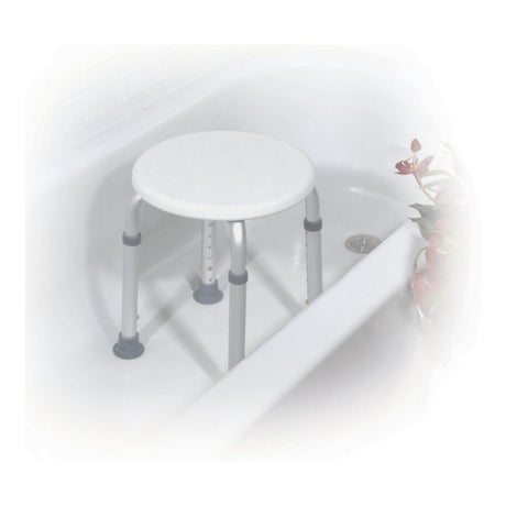 Round shower stool with gray legs next to a bathtub on a white background - okotoks hc pharmacy