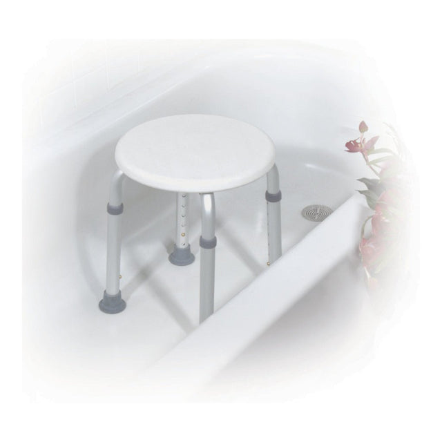 Round shower stool with gray legs next to a bathtub on a white background - okotoks hc pharmacy