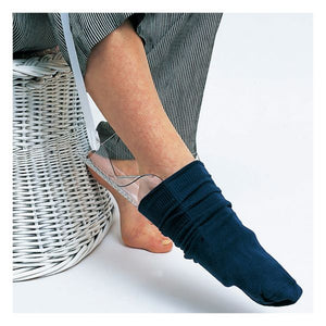 Person wearing a navy sock with a clear sandal on a white background - okotoks hc pharmacy