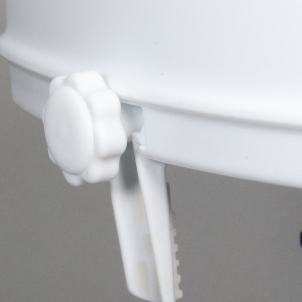 Close-up of a white plastic component on a gray background - okotoks hc pharmacy