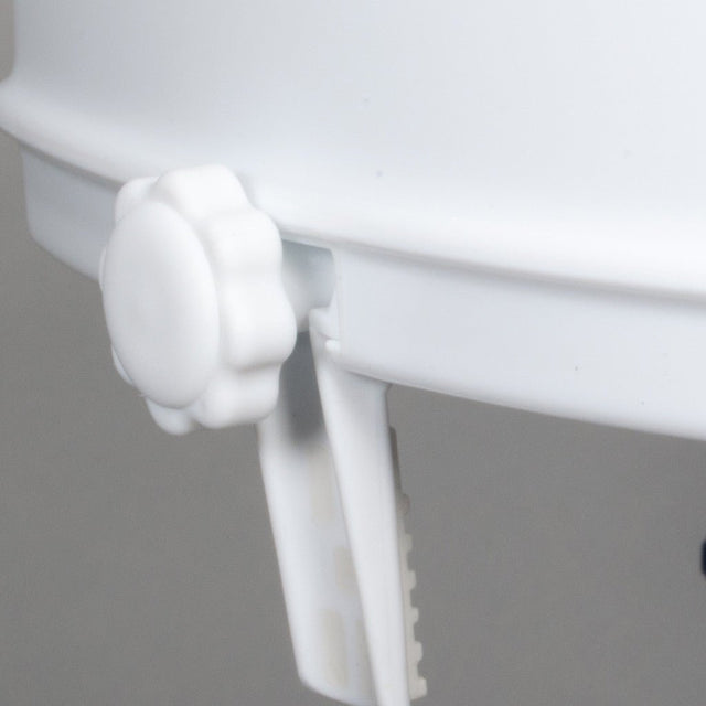 Close-up of a white plastic component on a gray background - okotoks hc pharmacy