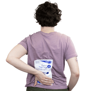 Person holding an instant cold pack on a white background - okotoks hc pharmacy
