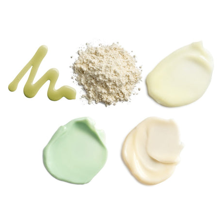 Cosmetic products including a powder, a green smear, a beige powder, and two white smears on a white background. - okotoks hc pharmacy
