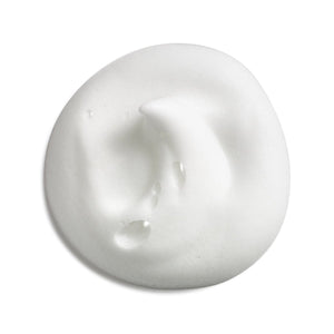 A dollop of thick, creamy white cosmetic product, likely a moisturizer or facial cream, with a smooth, textured surface and small water droplets on a clean white background. - okotoks hc pharmacy