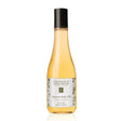 Bottle of Eminence Apricot Body Oil on a white background