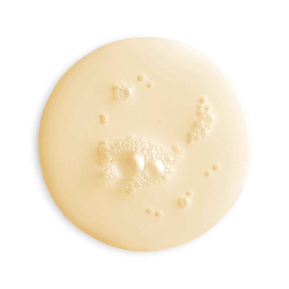 Close-up of a beige cream or lotion with bubbles on a white background - okotoks hc pharmacy