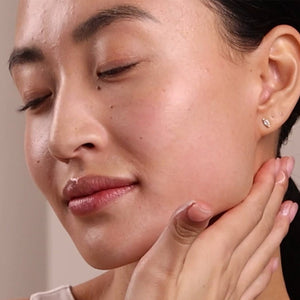 Close-up of a woman's face with a neutral background - okotoks hc pharmacy