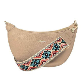 Beige handbag with a colorful strap on a white background - okotoks hc pharmacy