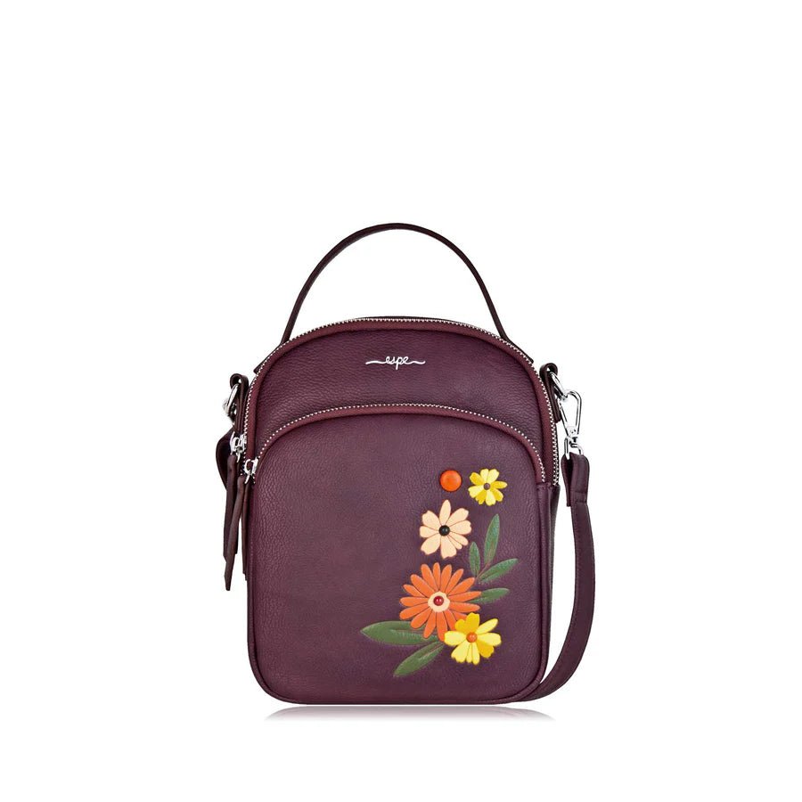 Purple handbag with floral embroidery on a white background - okotoks hc pharmacy