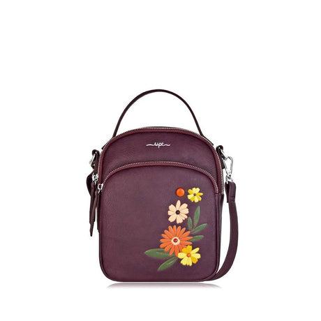 Purple handbag with floral embroidery on a white background - okotoks hc pharmacy