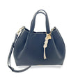 Blue handbag with a decorative charm on a white background - okotoks hc pharmacy