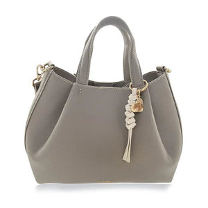 Gray handbag with a decorative charm on a white background - okotoks hc pharmacy
